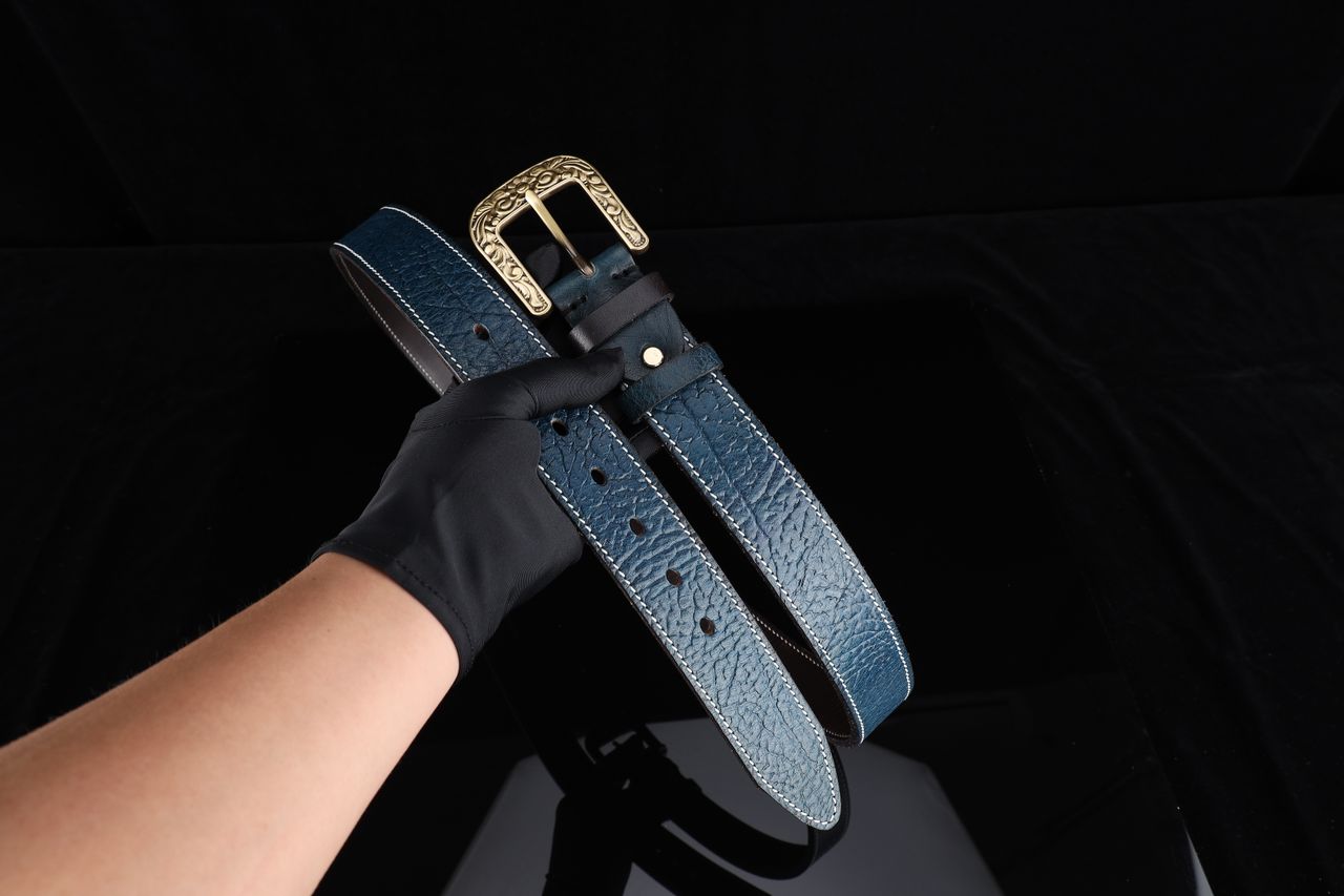 Premium blue leather belt with a decorative buckle, ideal for gifts and fashion accessorizing.